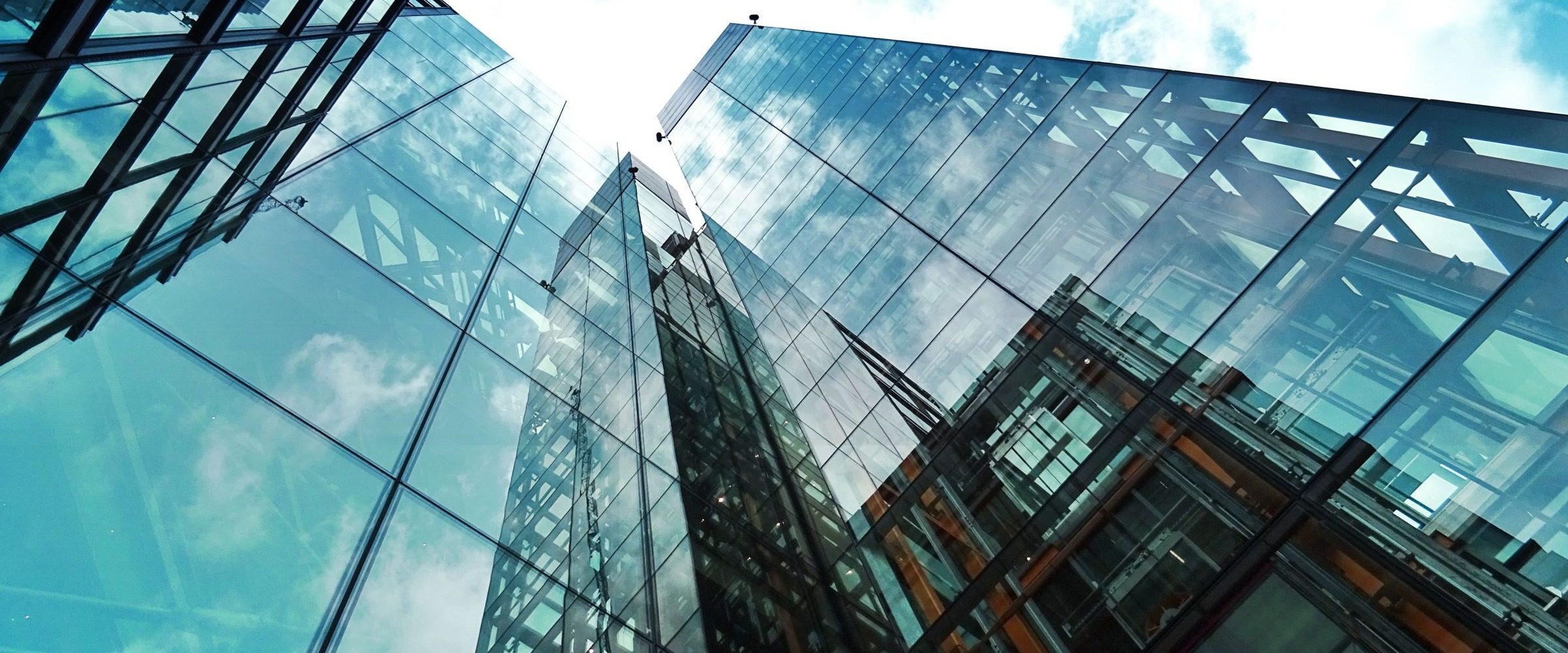 Modern commercial glass buildings without visible complex branding